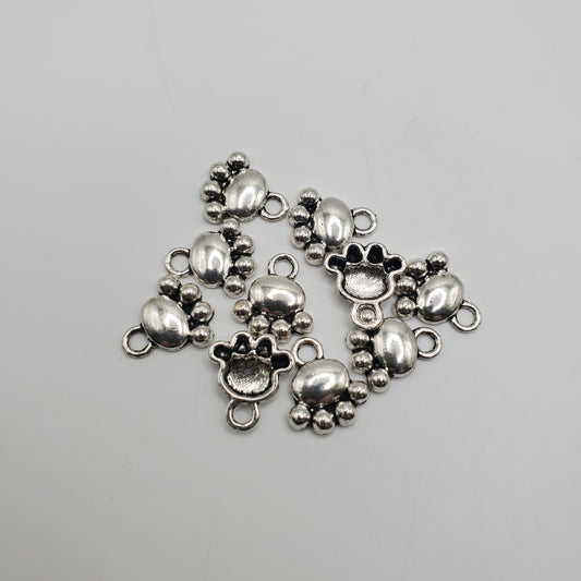 Pewter paw charm.