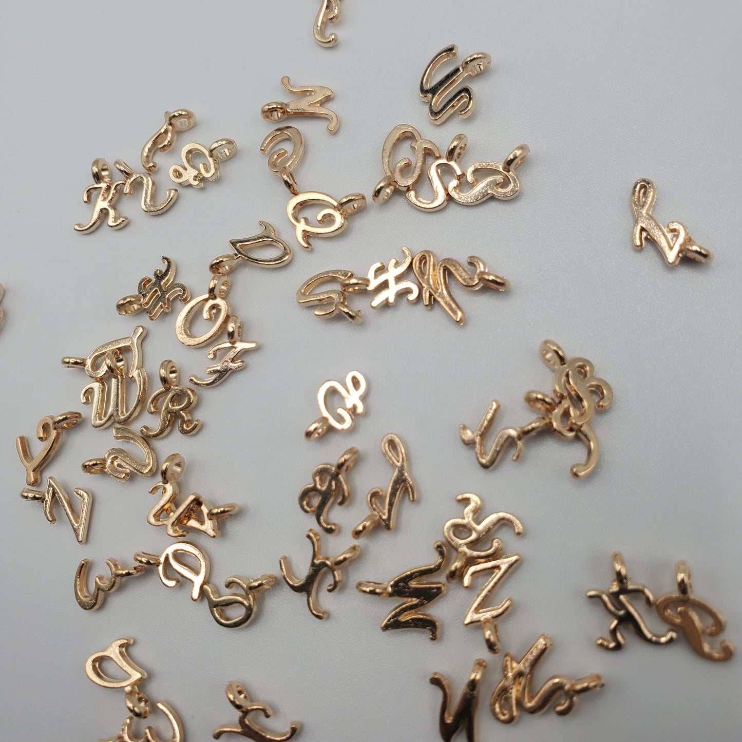 Gold Color Cursive Letter Charm