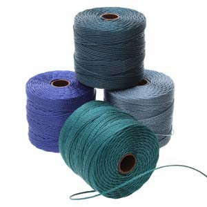 Four spools of S-Lon 210 Nylon Cord, each measuring 77 yards, are arranged in a pyramid formation. The colors from bottom left to top are dark blue, teal, light blue, and grey. Each spool is tightly wound with a visible loose end against a plain white background.
