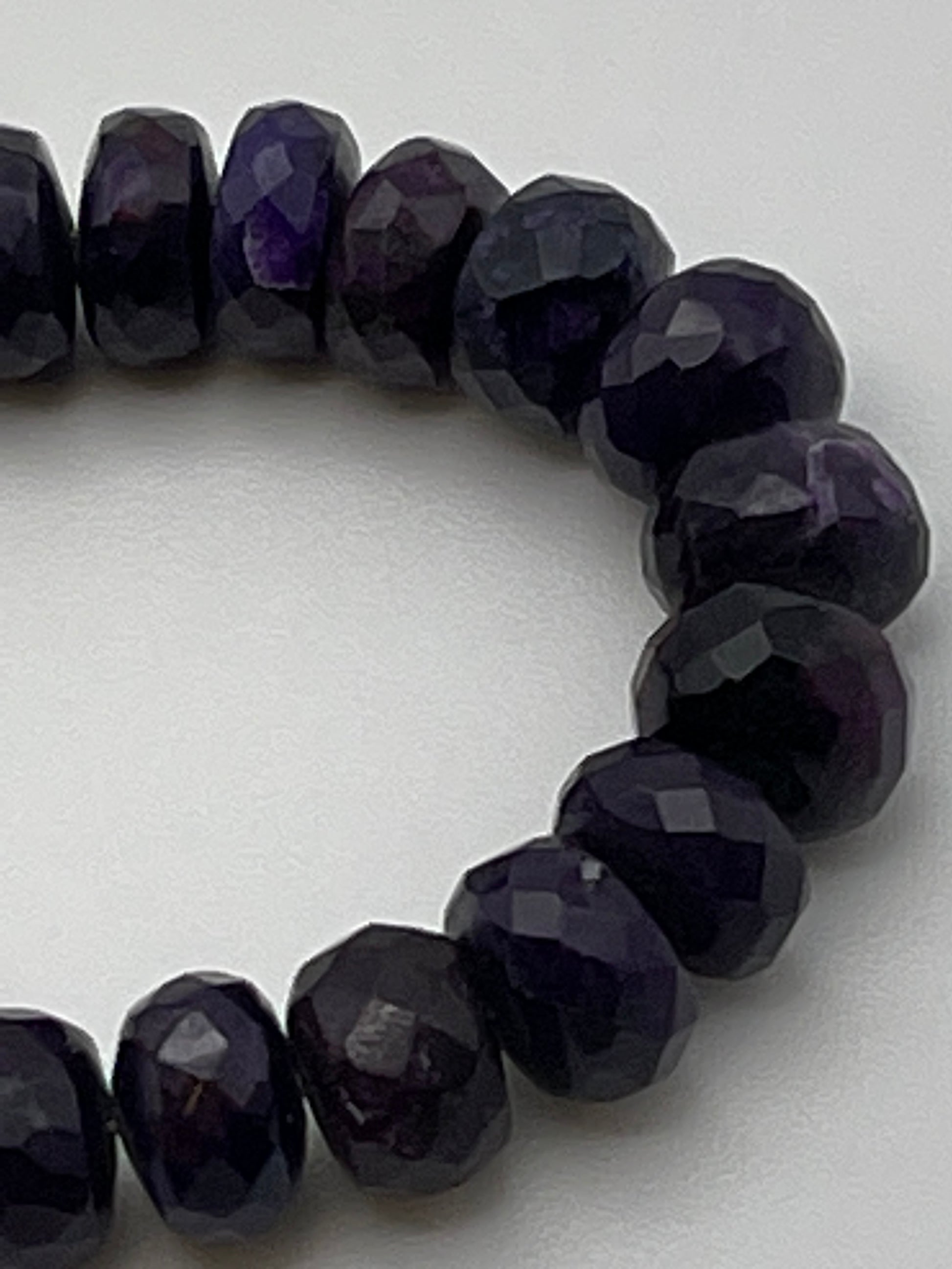 7.5mm Faceted Rondelle Sugilite bead strand.