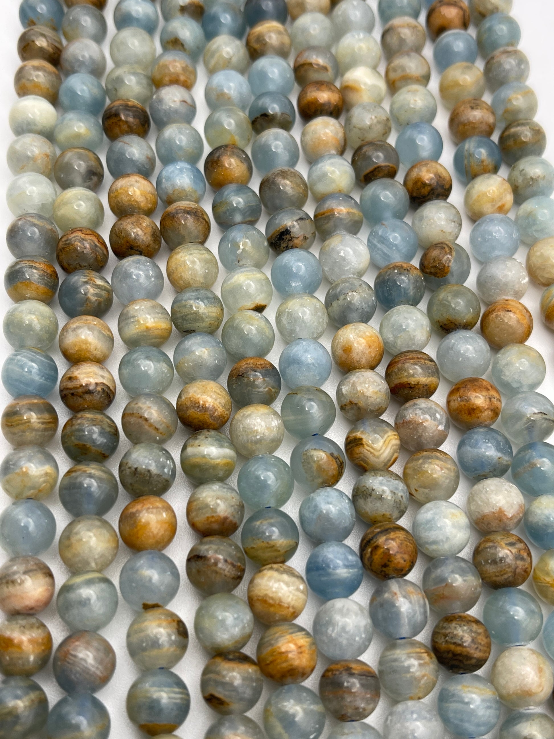 8mm Blue Calcite Round Smooth Bead Strand.